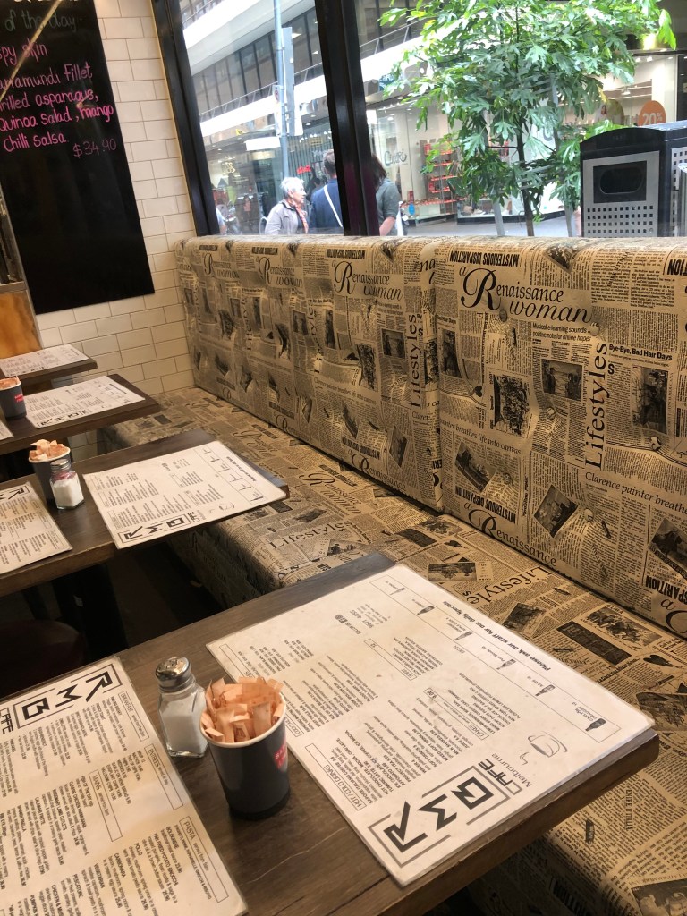 A stack of flyers on a table

Description automatically generated